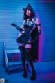 A woman dressed as a catwoman posing for a picture.