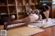 A woman laying on the floor in a black lingerie.