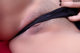 A close up of a woman's butt with a black panties.
