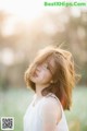 A little girl with her hair blowing in the wind.