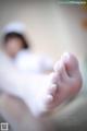 A close up of a person's feet in white socks.