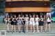 A group of women standing in front of a building.